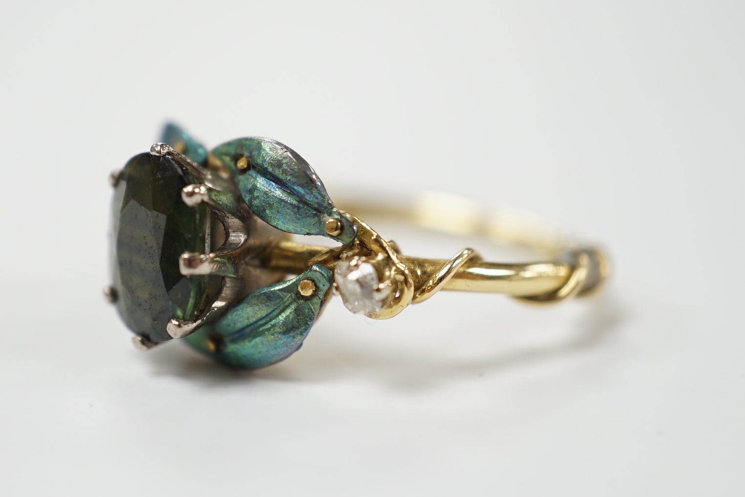 A late Victorian gilt white metal and green paste set bug brooch, 23mm.